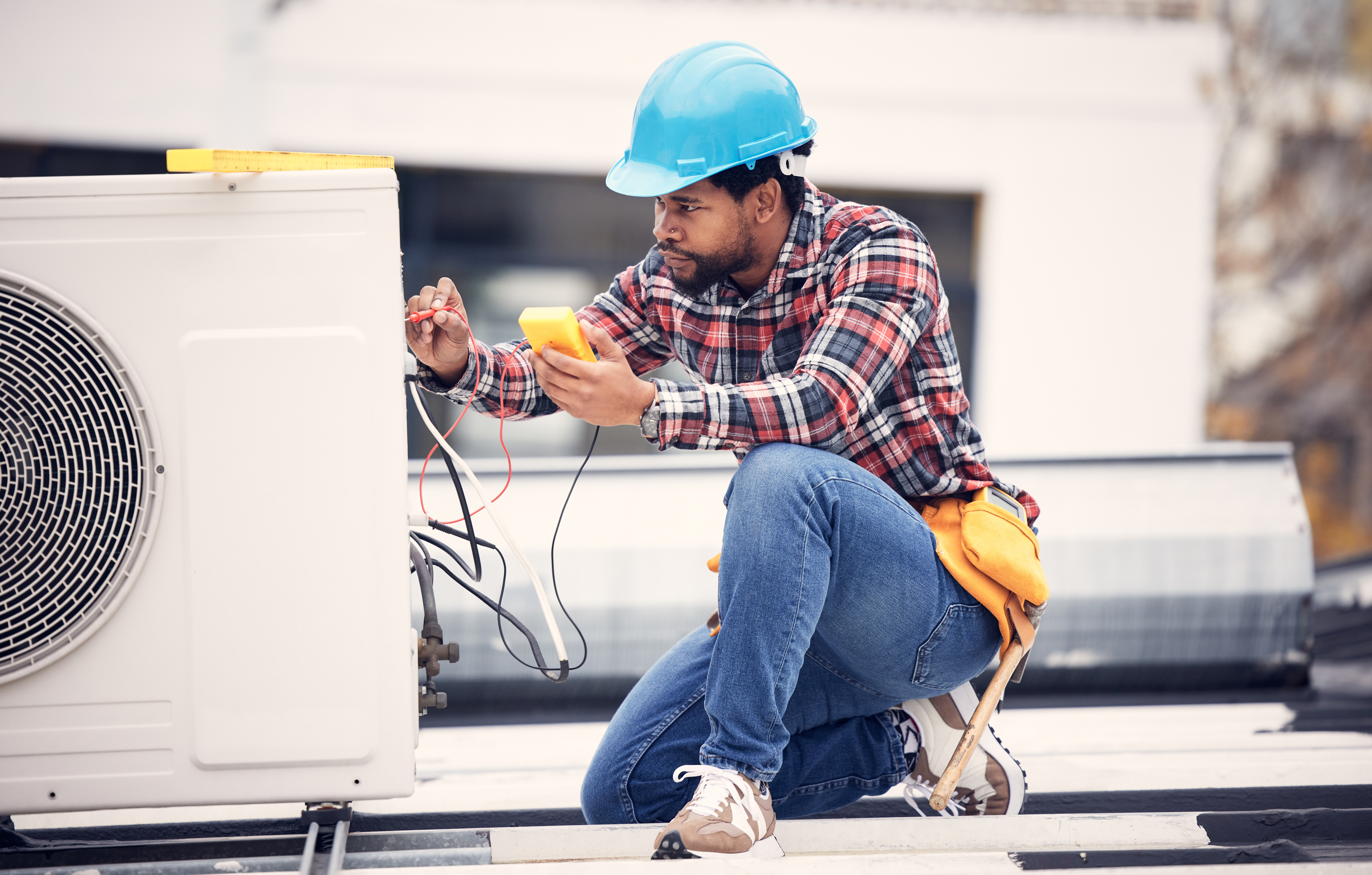 Air conditioner, cables and technician man ac repair, maintenance or working on electrical power ge